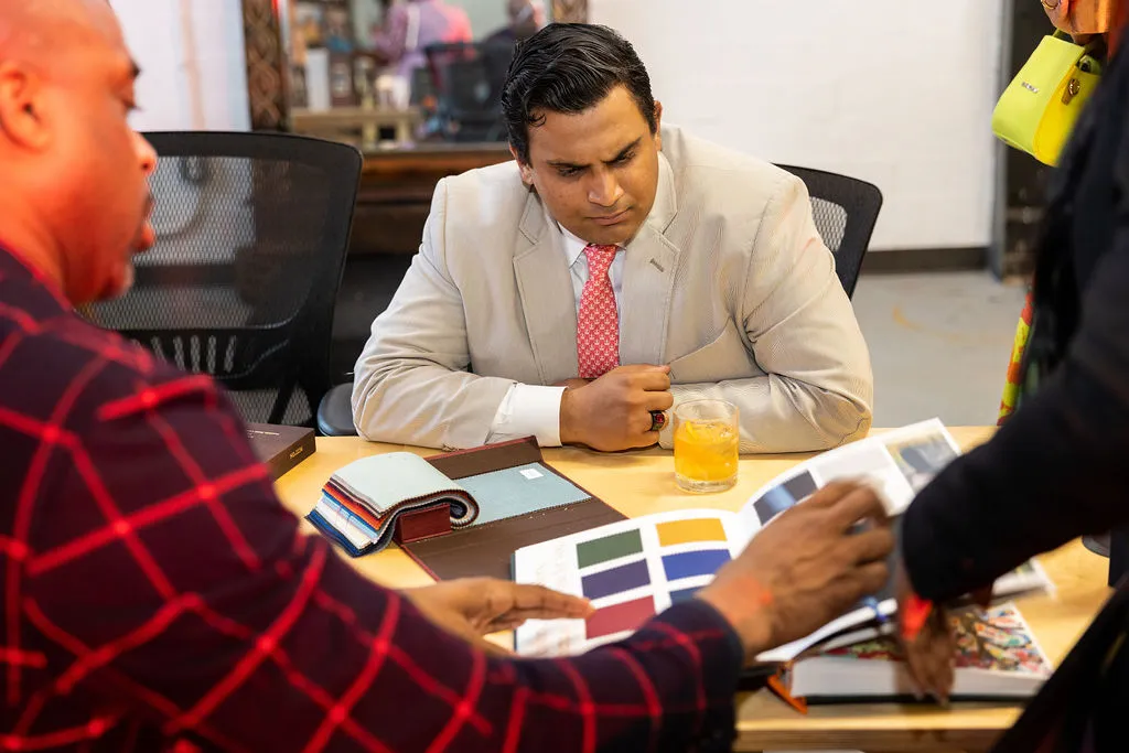 People on a meeting, checking colors in a book